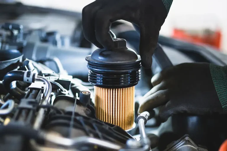 Mechanic Replacing Car Oil Filter For New One