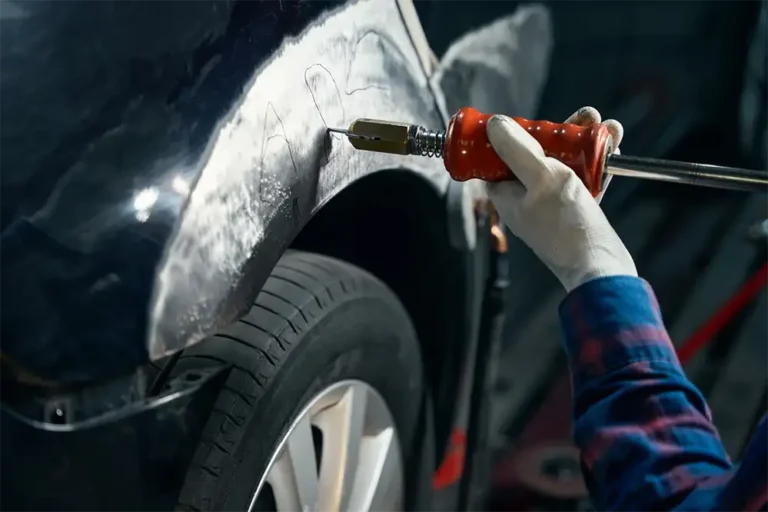 Mechanic Repairing Stratch and Dent Car