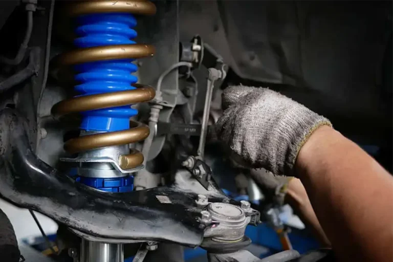 Mechanic Checking All Suspension And Steering System